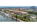 Beautiful waterfront condos with balconies, boat docks, and tropical landscaping at 5000 Culbreath Key Way # 8-319, Tampa, FL 33611