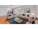 Well-decorated living room with stylish furniture, a cozy rug, and bright window at 6638 12Th N Ter, St Petersburg, FL 33710