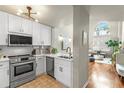 Well-appointed kitchen with modern appliances, white cabinets, and marble countertops; a sleek and functional design at 700 S Harbour Island Blvd # 105, Tampa, FL 33602