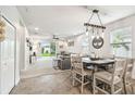 Open-concept living and dining area with neutral tones, creating a welcoming atmosphere at 8228 Sunlit Horizon Ln, Land O Lakes, FL 34637