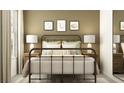Bedroom featuring a metal bed frame, lamps, decor, pillows and a natural color scheme at 8449 Sea Ray Run, Parrish, FL 34219