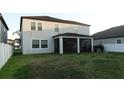 Spacious backyard features a screened lanai, grass lawn and privacy fence enhancing outdoor living and entertainment at 11704 Navajo Sandstone St, Riverview, FL 33579