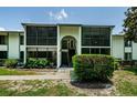 A Two-story condo building with screened in patios on both levels, great natural light at 1290 Pine Ridge E Cir # G1, Tarpon Springs, FL 34688