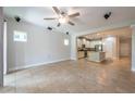 Bright and airy living room that seamlessly transitions into a modern kitchen and dining area at 16226 Bayberry View Dr, Lithia, FL 33547