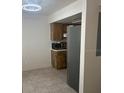 Compact kitchen area with neutral finishes and ample storage space at 16530 Brigadoon Dr, Tampa, FL 33618