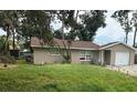 Cozy one-story home with a brown roof, complemented by a well-manicured front yard at 192 Tulane Rd, Venice, FL 34293
