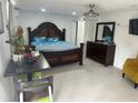 Spacious primary bedroom featuring a king-sized bed and elegant furniture at 192 Tulane Rd, Venice, FL 34293