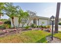 Charming single story home with a well-manicured lawn and garden at 2115 N Halcyon Dr # 510, Sun City Center, FL 33573