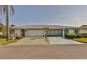 Charming single story home with a well-manicured lawn and two-car garage at 2115 N Halcyon Dr # 510, Sun City Center, FL 33573