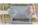 Aerial shot of the roof, fenced-in yard with patio, and neighboring house at 260 Sw Lincoln N Cir, St Petersburg, FL 33703
