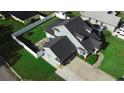 This aerial view shows the home, the yard, and the driveway at 2797 Cordova S Way, St Petersburg, FL 33713