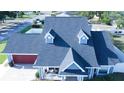 This aerial view highlights a home with a new roof, dormer windows, and well-manicured landscaping at 2797 Cordova S Way, St Petersburg, FL 33713
