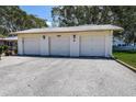 Exterior shot of detached garages with white doors at 3122 37Th S Ln # C, St Petersburg, FL 33711