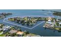 Aerial view showcasing the property's waterfront location, boat access, and proximity to amenities at 3174 Sanibel Dr, Hernando Beach, FL 34607
