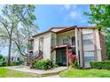 This charming two-story condo features beautiful landscaping and a stairway to the upper units at 3455 Countryside Blvd # 31, Clearwater, FL 33761