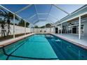 Inviting screened-in pool with clear blue water, perfect for relaxation and entertaining at 4704 Shale Pl, Tampa, FL 33615