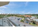 Balcony view overlooking lush landscaping and parking at 4900 Brittany S Dr # 805, St Petersburg, FL 33715