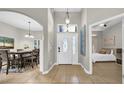 Welcoming entryway with a view of the dining area and bedroom, showcasing open floor plan at 650 Arbor Ln, Largo, FL 33770