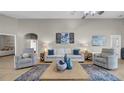 Comfortable living area featuring tile floors, stylish decor, and plenty of natural light at 650 Arbor Ln, Largo, FL 33770