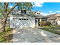 Charming single-Gathering home with a two-car garage, screened porch and mature landscaping at 6526 Summer Cove Dr, Riverview, FL 33578