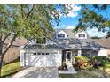 Charming single-Gathering home with a two-car garage, screened porch and mature landscaping at 6526 Summer Cove Dr, Riverview, FL 33578