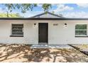 Charming home with updated exterior lighting at 8107 N 11Th St, Tampa, FL 33604