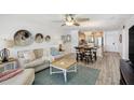 Open concept living space with kitchen access, bar seating, and modern decor at 865 S Gulfview Blvd # 308, Clearwater, FL 33767