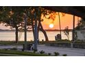 Scenic water views at sunset with mature trees highlighting the beauty of this neighborhood in a desirable location at 1039 Union St, Clearwater, FL 33755