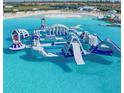 Aerial view of an aqua park with inflatable structures and water slides at 16815 Trite Bend St, Wimauma, FL 33598