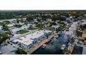 Aerial view of waterfront property featuring boat docks and a neighborhood canal system at 2186 Edythe Dr # 11, Dunedin, FL 34698