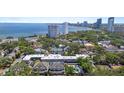 An aerial view shows the property's proximity to the beach, water views, and surrounding neighborhood at 2207 S Carolina Ave # 7, Tampa, FL 33629