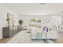 Inviting living area offers a comfortable seating arrangement, modern decor, and seamless flow to the kitchen at 2901 Forestwood Dr, Seffner, FL 33584