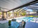 Inviting screened pool area with ample patio space, ideal for relaxation and enjoying the outdoors at 37 W Boyer St, Tarpon Springs, FL 34689