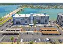 Condo building with nearby beach access, boat dock, and ample parking for residents and guests at 500 Treasure Island Cswy # 607, Treasure Island, FL 33706