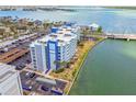 Coastal condo building showcasing water views, parking, and boat access at 500 Treasure Island Cswy # 607, Treasure Island, FL 33706