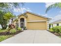 Well maintained single story home with manicured front yard and two car garage at 5205 Lansdowne Way, Palmetto, FL 34221