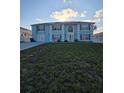 Charming two-story home with solar panels and a well-maintained lawn at 5391 Baldock Ave, Spring Hill, FL 34608