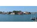 Waterfront homes with private docks line a tranquil waterway, creating a picturesque neighborhood scene at 5930 Bahama N Way, St Pete Beach, FL 33706