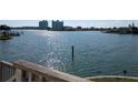 Scenic waterfront view showcasing sparkling waters and distant buildings on a sunny day at 5930 Bahama N Way, St Pete Beach, FL 33706