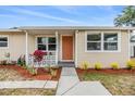 Inviting front porch with decorative details and fresh landscaping, creating curb appeal at 6816 13Th N St, St Petersburg, FL 33702