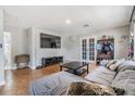 Bright living room with modern decor, tiled floors, and access to a backyard patio at 6816 13Th N St, St Petersburg, FL 33702