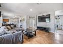 Spacious living room features neutral colors, a large TV, and ample seating at 6816 13Th N St, St Petersburg, FL 33702