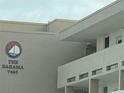 Close up exterior of The Bahama building sign, showing the building number at 7425 Bay Island S Dr # 203, South Pasadena, FL 33707