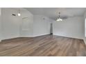 Spacious living room featuring wood-look floors and plenty of natural light at 10048 Creek Bluff Dr, Riverview, FL 33578