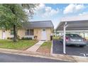 Charming single-story home with a covered carport and well-maintained front lawn at 11723 Boynton Ln # 1, New Port Richey, FL 34654