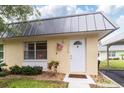 Close-up of a well-kept single-story home featuring a neat front lawn at 11723 Boynton Ln # 1, New Port Richey, FL 34654