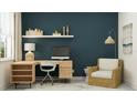 Contemporary home office with blue accent wall, modern desk, stylish chair, and decorative shelving at 11761 E 74Th Cir, Palmetto, FL 34221
