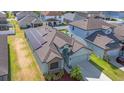 Lovely single-story home with a solar panel system, a two-car garage, and a well-manicured lawn at 11831 Thicket Wood Dr, Riverview, FL 33579