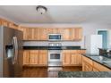 Well-equipped kitchen featuring stainless steel appliances and granite countertops at 1310 Hilton Pl, Tampa, FL 33604