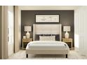 Elegant bedroom with a padded headboard bed, neutral color scheme, and bedside lamps at 15027 Zircon Red Dr, Wimauma, FL 33598
